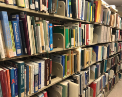 Photo of books on a shelf at Countway Library