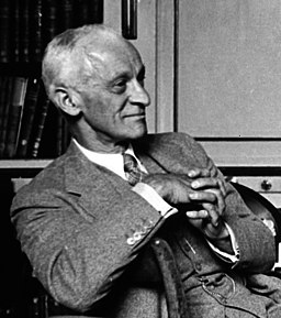 Harvey Cushing sitting casually in a chair.