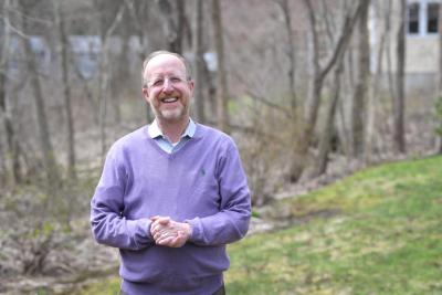 Scott Harris Podolsky, MD standing outside and smiling.