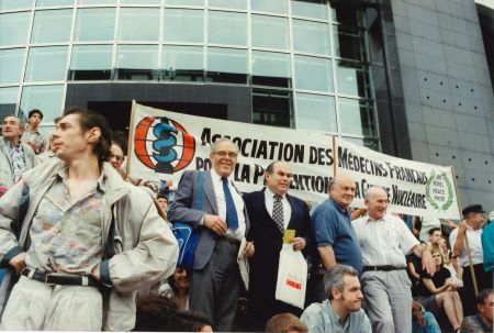 Group of people rally around a banner