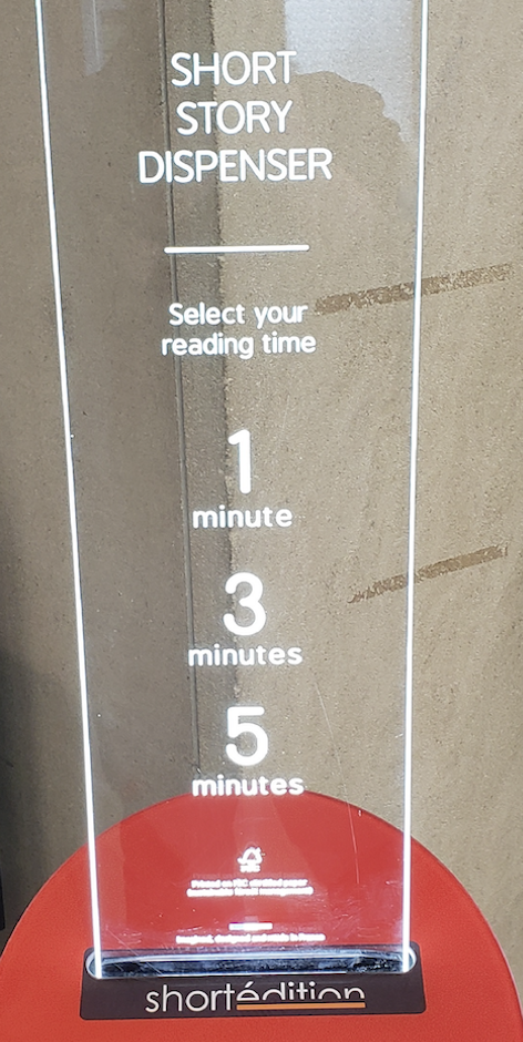 A short story dispenser prompts users to select their reading time: 1 minute, 3 minutes, or 5 minutes.
