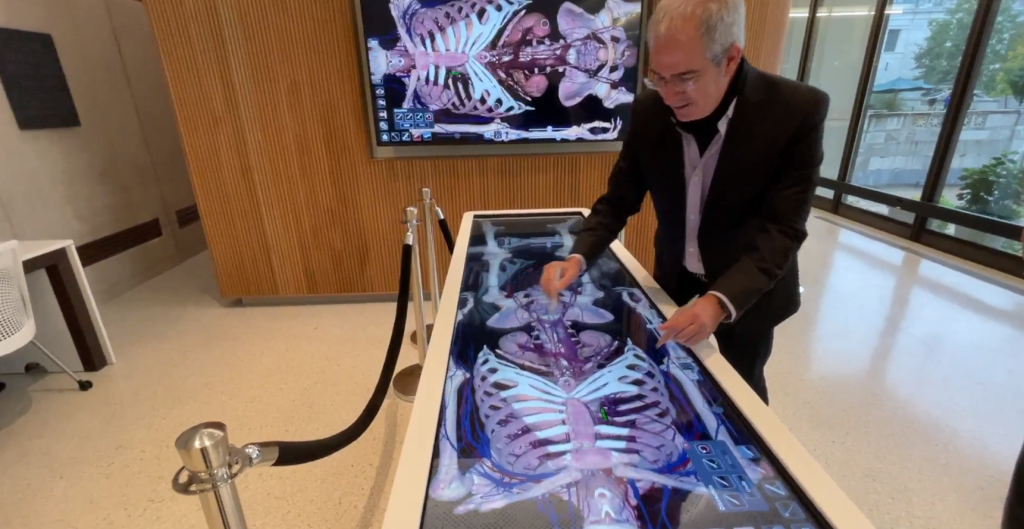 Photo of Anatomage Table and digital monitor in use in the Countway Makerspace.