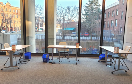 3 tables in Countway Library Room 102, each with their own chair