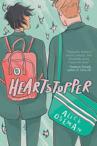 The cover of Heartstopper Volume 1 shows two young men wearing backpacks walking close together as leaves fall around them.