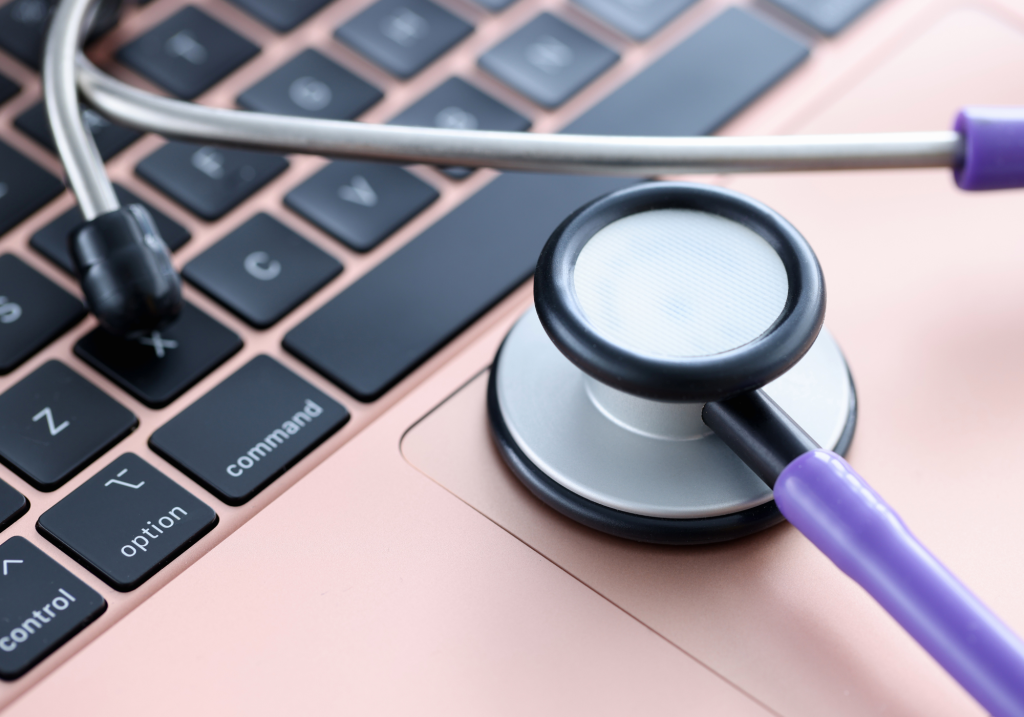 Photo of a stethoscope on a laptop