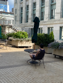 man sitting at a table on HMS campus