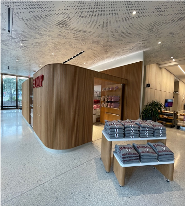 Coop shop with grey sweatshirts on display