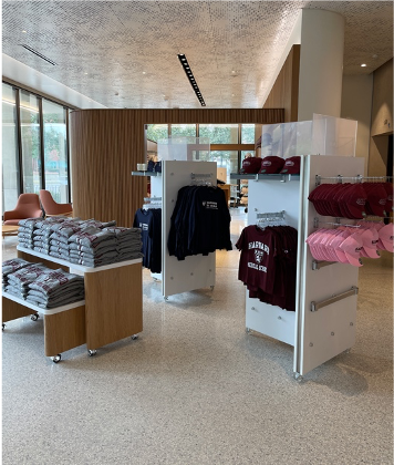 coop shop with shirts, hats, and sweatshirts on display