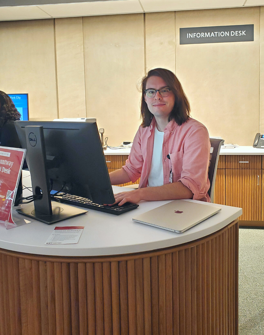 Corey Purcell at the new Information Desk in Countway Library.