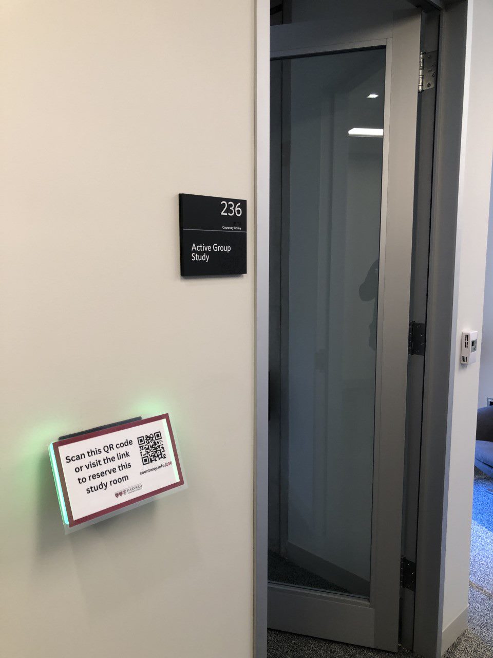 Active Group Study room 236 with the new reservation sign outside the door.