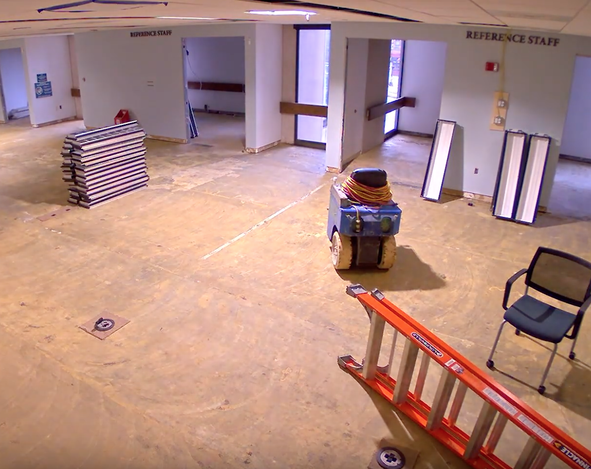 reading room with carpet and ceiling panels removed.