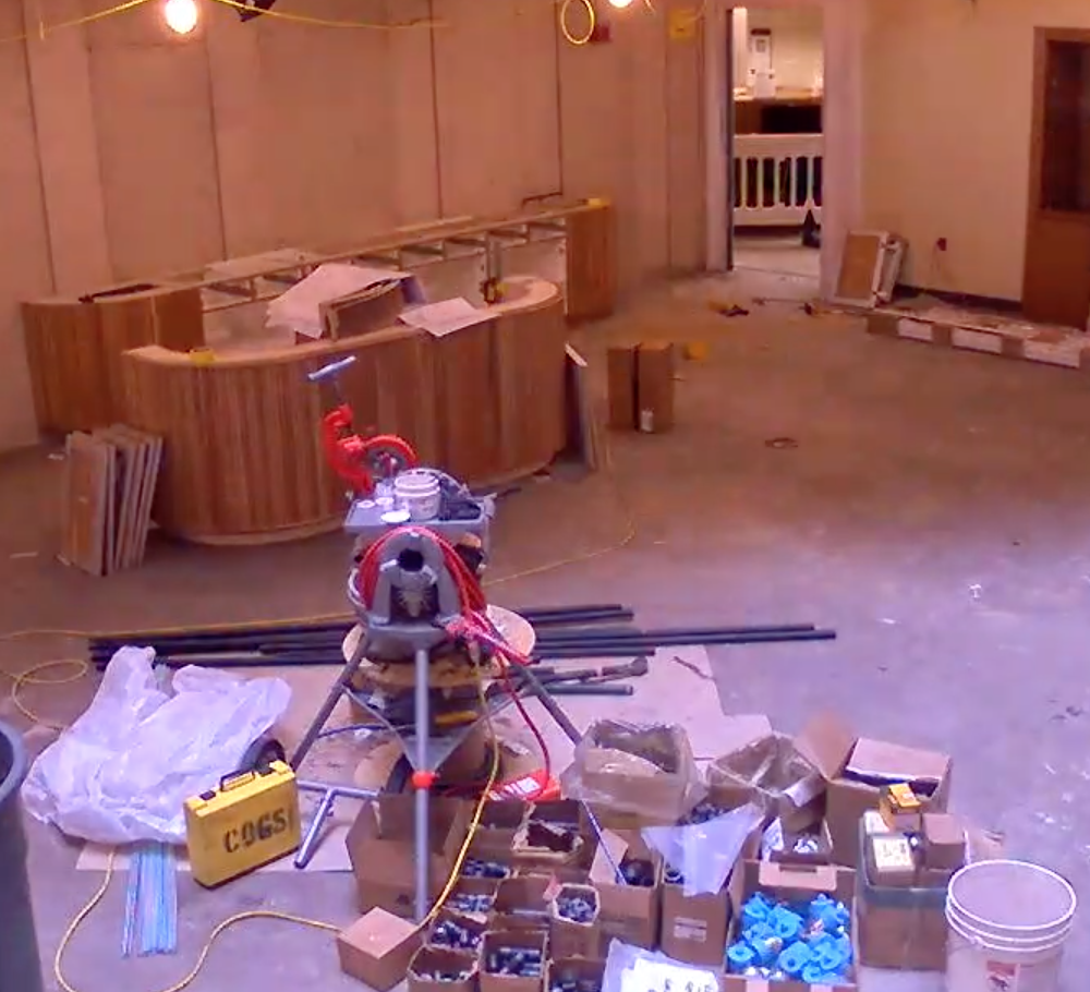 lower level 1 atrium construction. ceiling and floor removed. new circulation desk is assembled.