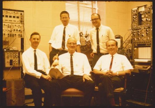 Photo of five men with electronic equipment