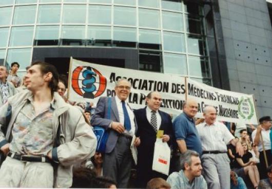 Group of people rally around a banner
