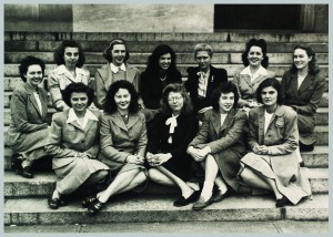 first class of women accepted to Harvard Medical School, posing outside on the building steps in 1945.