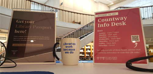 signs on the Countway Information Desk