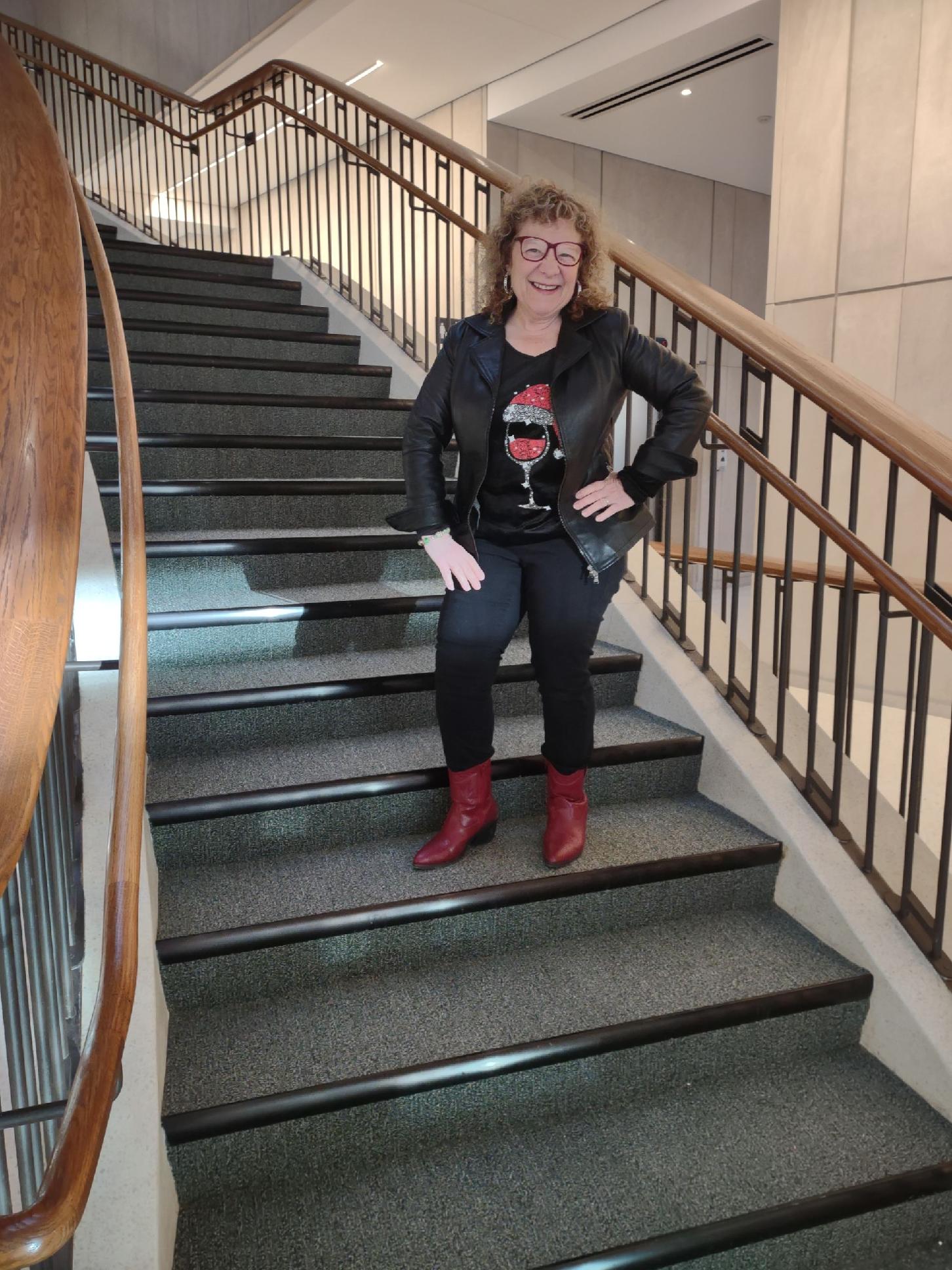 Elaine Martin, the director of library, on the Countway stairs