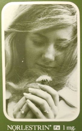 Cover of an instructional booklet for a brand of birth control pills. The cover has a picture of a woman looking down at a flower. She is wearing a wedding ring.