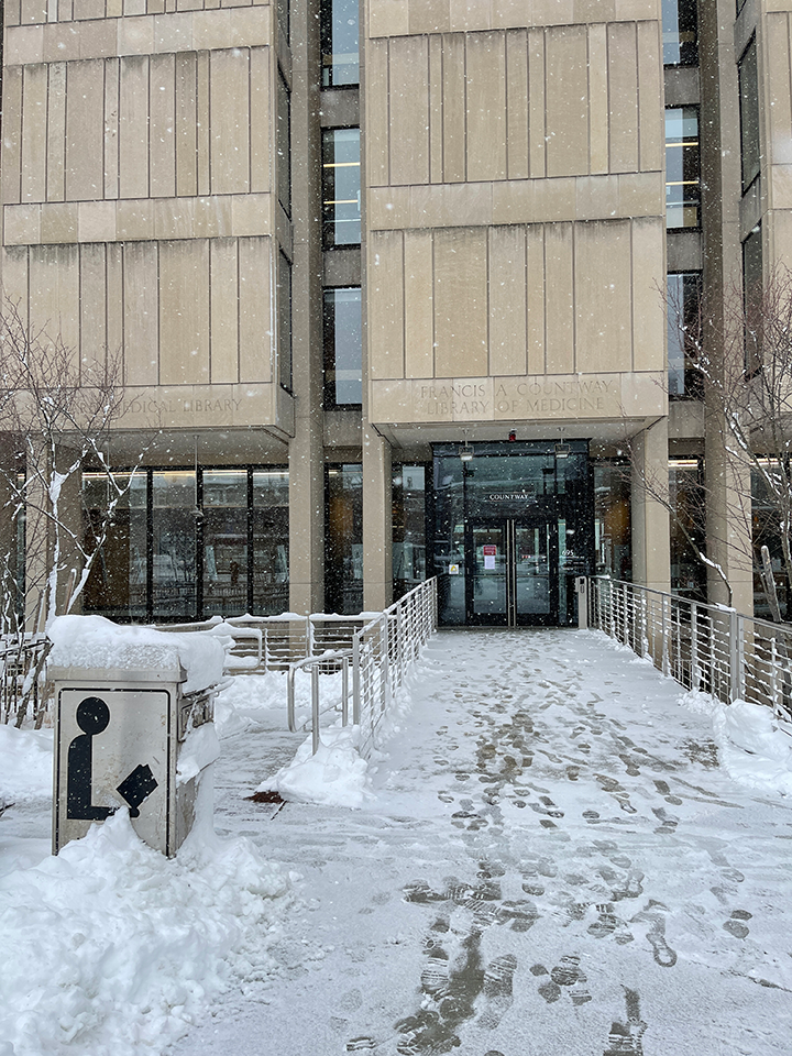 snow and the main entrance of the library